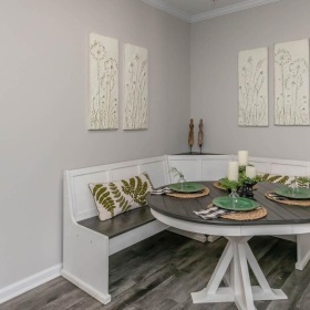 a room with a table and chairs