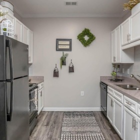 a kitchen with white cabinets